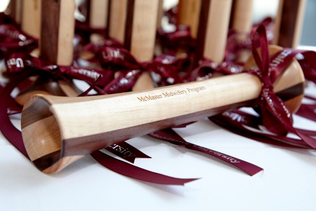 Stethoscope: Several wooden Pinard horns wrapped with McMaster University ribbons.